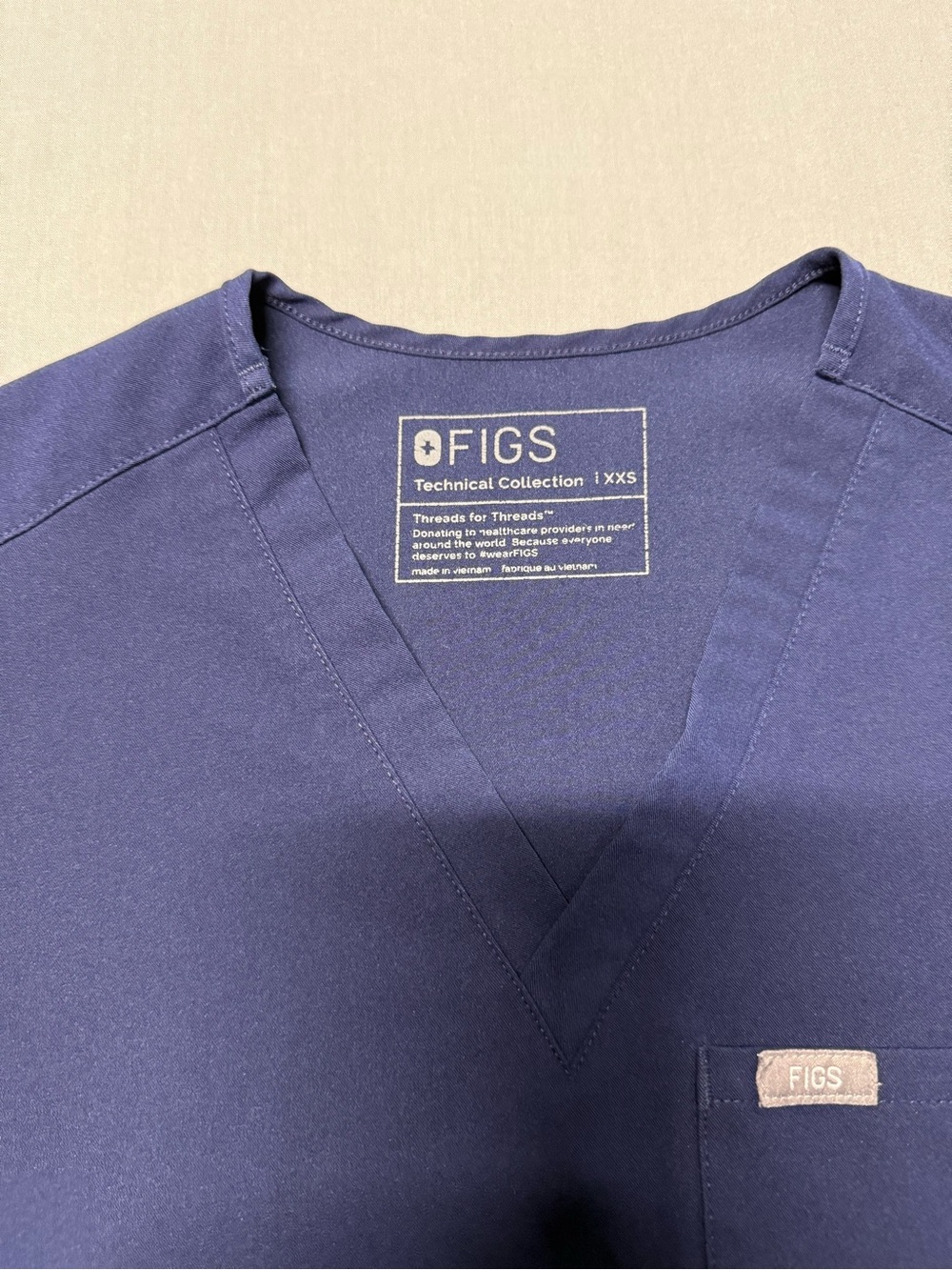 FIGS Technical Collection Scrub Top Uniform in Navy Blue - Picture 2 of 5